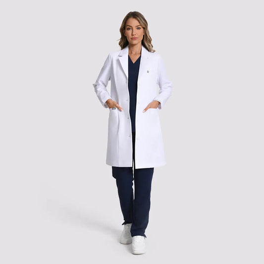 KungFu Scrubs women's long white lab coat full front view over navy scrubs